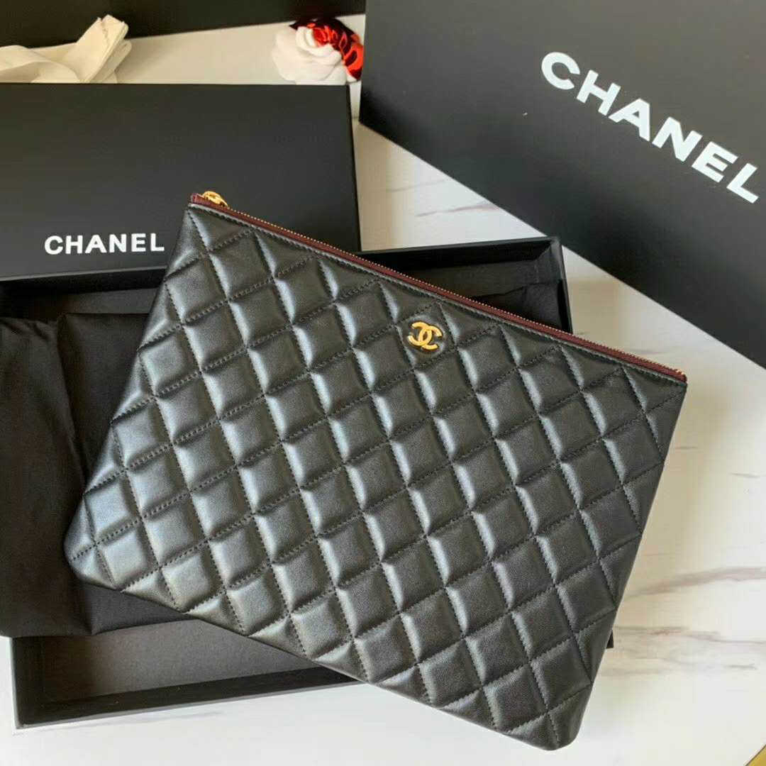 Shop CHANEL Classic Mini Pouch (A82365 Y01480 C3906) by .loulou.