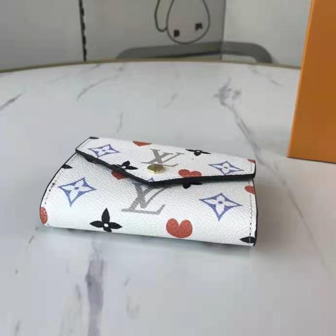 Louis Vuitton Zoe Wallet Game On White in Coated Canvas with Gold