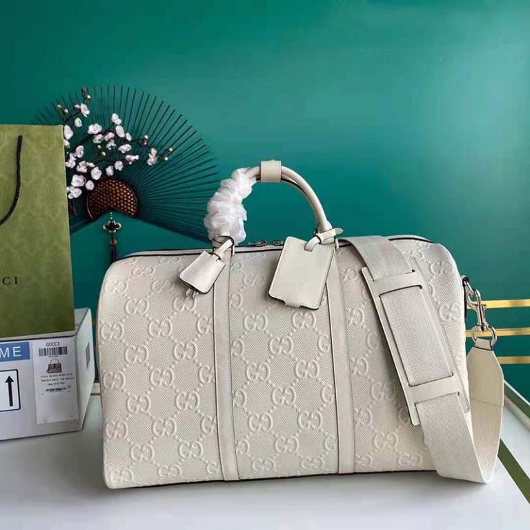 gucci embossed duffle bag