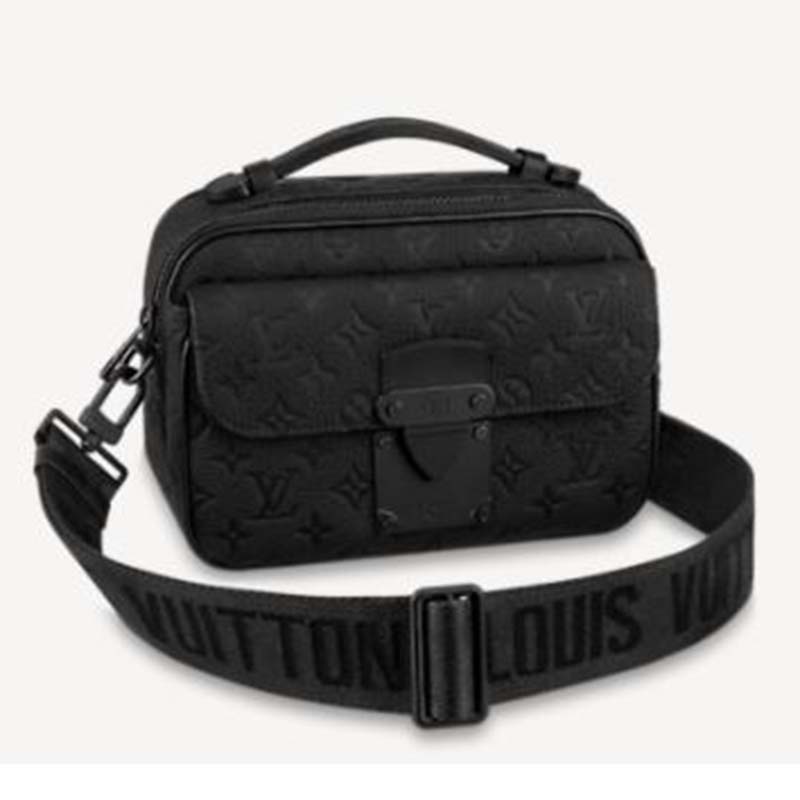 Louis Vuitton, Love note. Crafted in black leather with gold-toned LV  turn-lock closure and chain link. Turn lock closure opens to a black suede  interior with s…
