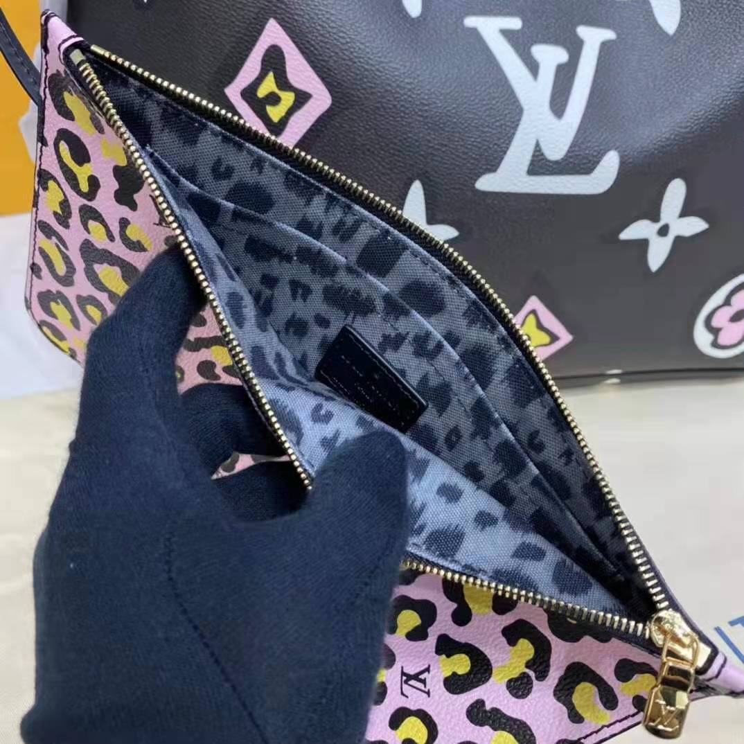 Louis Vuitton “Neverfull MM” Tote coated fabric cowhide leather trim.