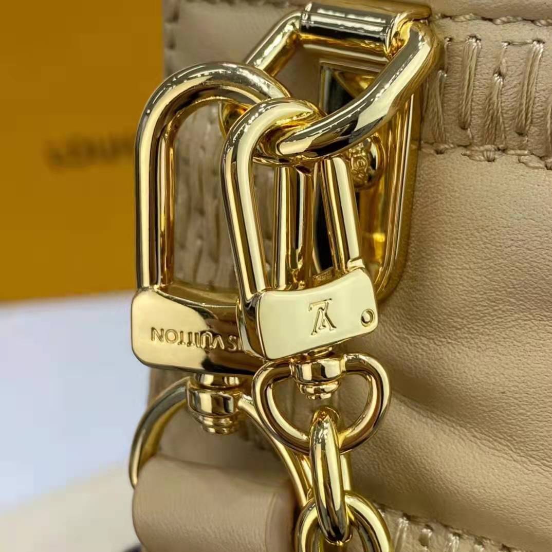Leather bag charm Louis Vuitton Beige in Leather - 37640339
