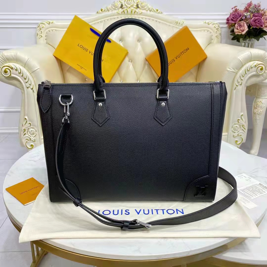 Louis VUITTON. Suitcase in black taiga cowhide. Height:…