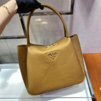 Prada Women Medium Leather handbag with the Prada Metal Lettering Logo Illuminating Its Center-brown (1)