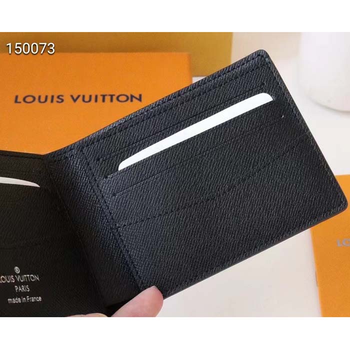 LOUIS VUITTON, black taiga leather wallet. - Bukowskis